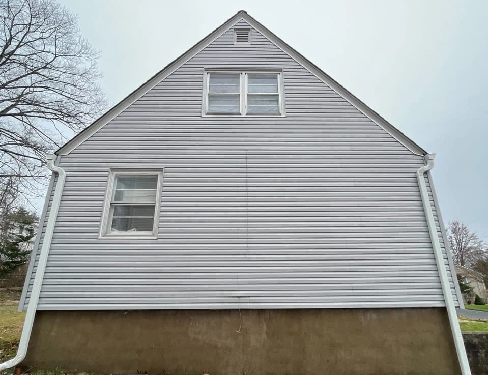 Lorain Power Washing technician performing detailed house washing in Lorain residential area