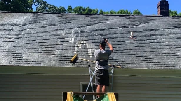 Before and after results of roof washing by Lorain Power Washing in Lorain